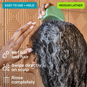 Ethique Curl-Defining Shampoo Bar in use on curly hair