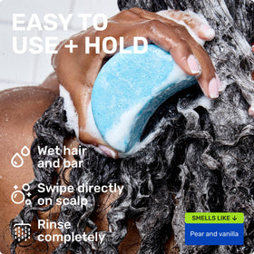 Ethique Hydrating Shampoo Bar on a bathroom shelf