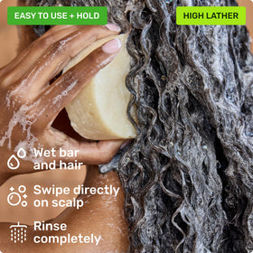Ethique Scalp Health Shampoo Bar in use during shower