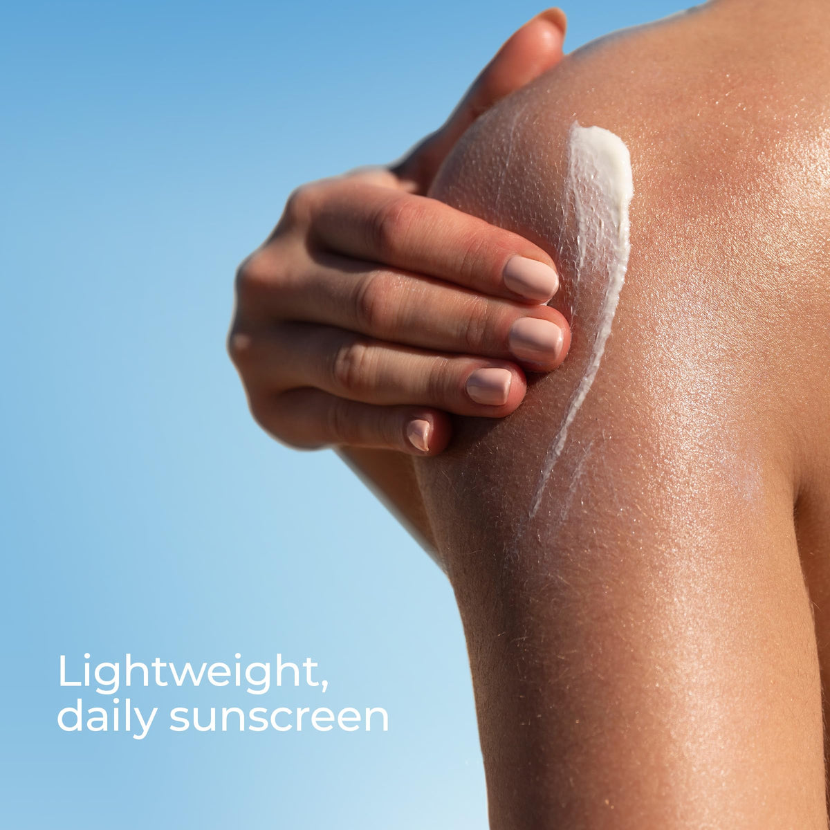 Eucerin sunscreen tube next to beach essentials