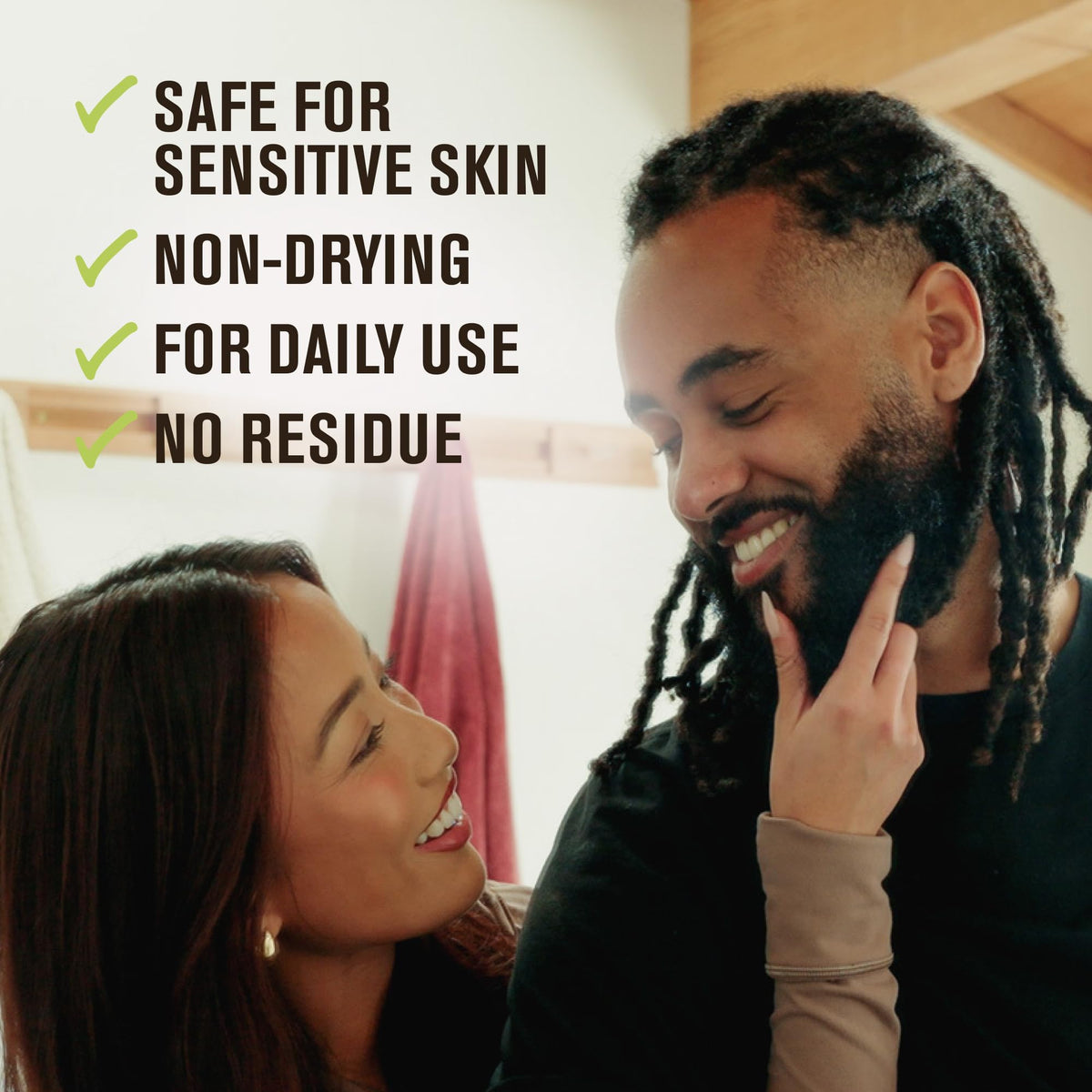 Every Man Jack Beard + Face Wash held in hand with foam