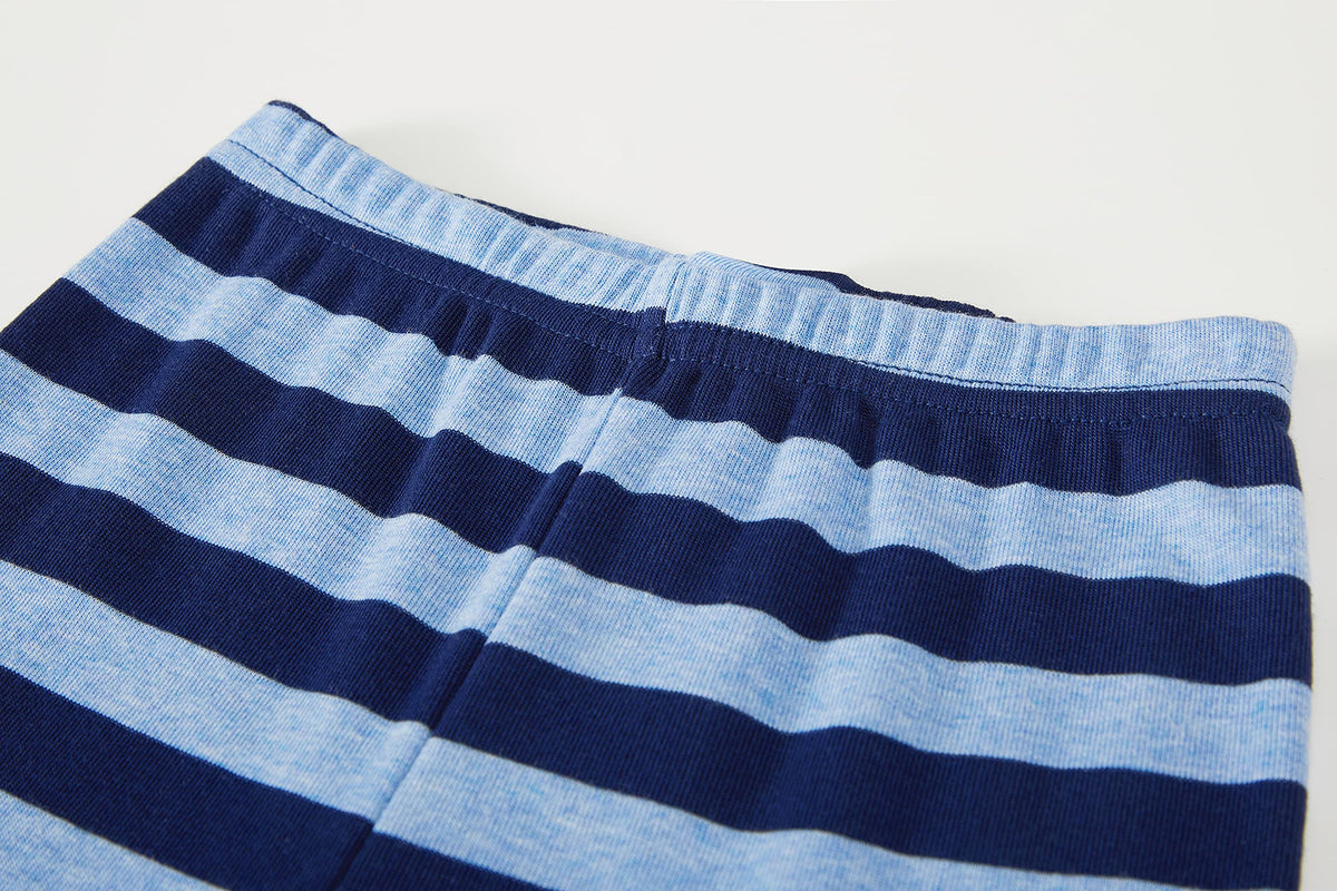 Family Feeling kids pajamas set laid flat, showing fabric texture