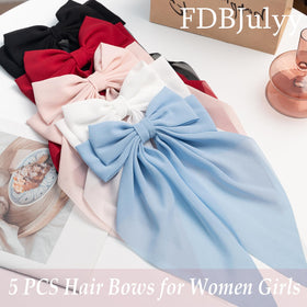 FDBJulyy big bow clips on a model with long hair