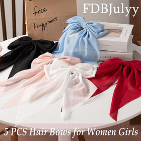 FDBJulyy bow clips holding thick hair in a stylish updo