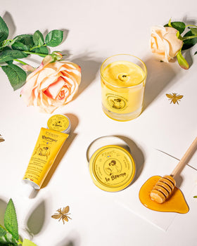 Feret Parfumeur balm beside fresh roses