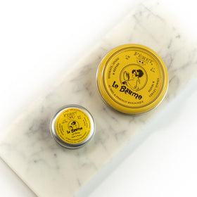 Feret Parfumeur balm on a vanity with soft lighting