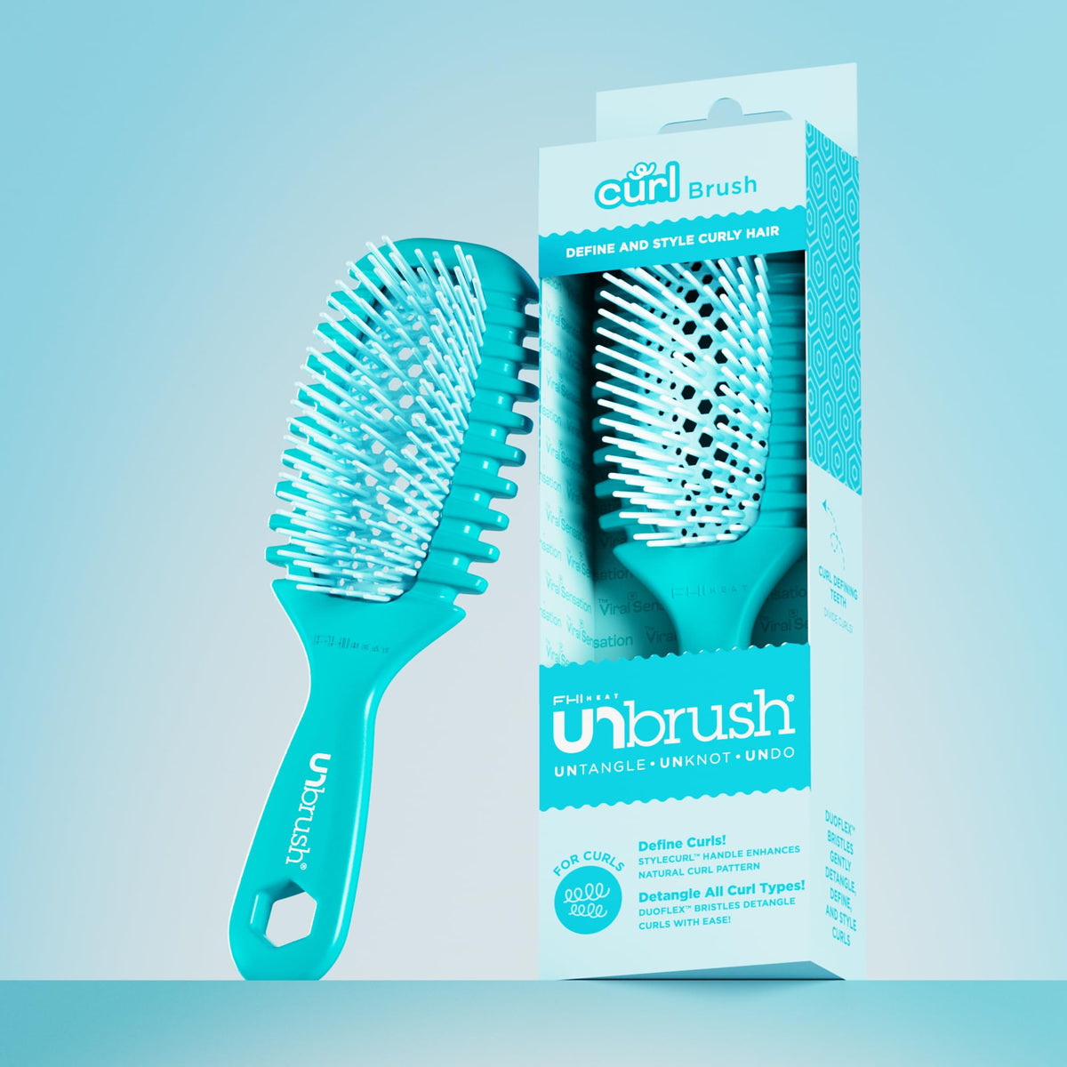 FHI Heat UNbrush Curl Detangling Brush in hand