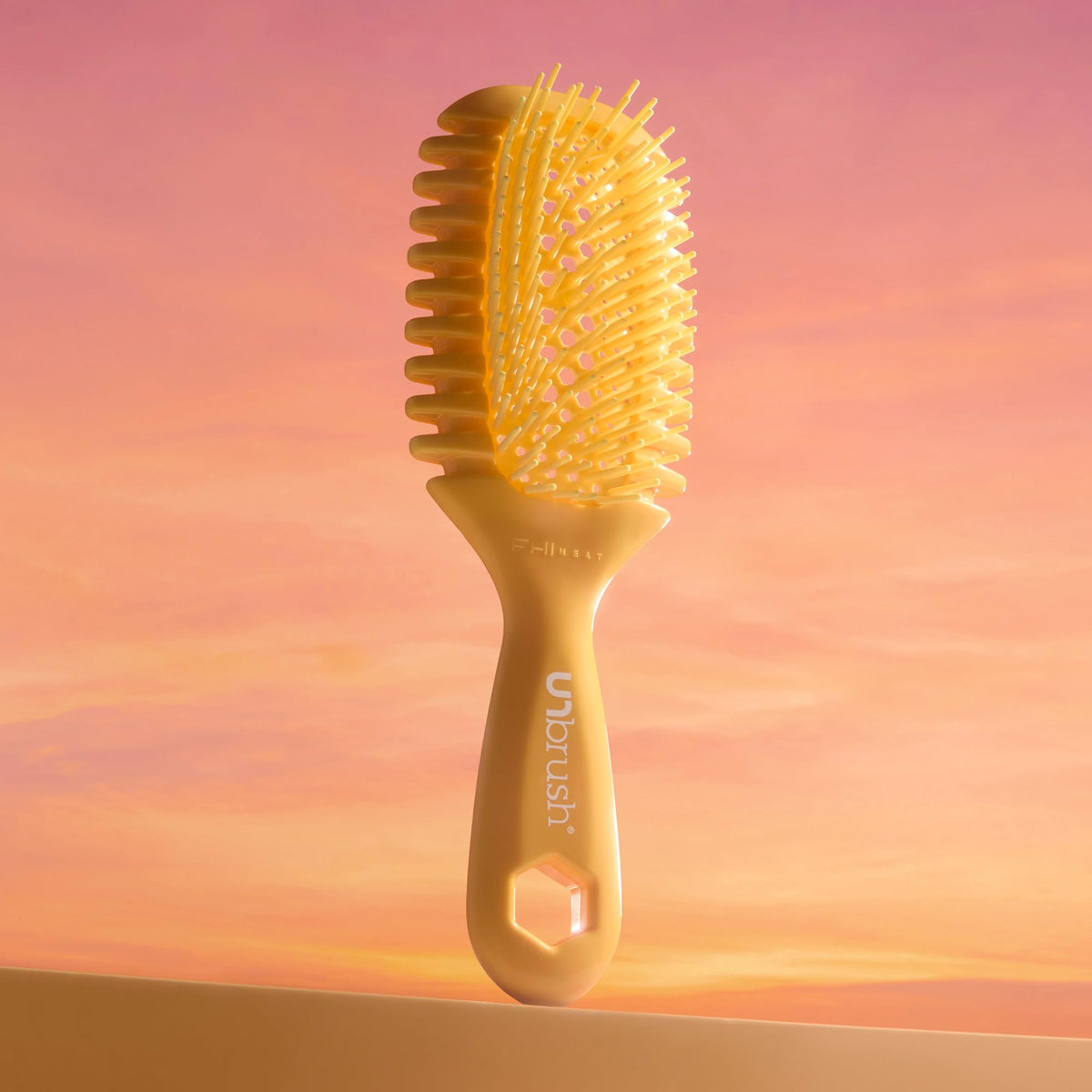 FHI Heat UNbrush Curl Detangling Brush in use on wet hair