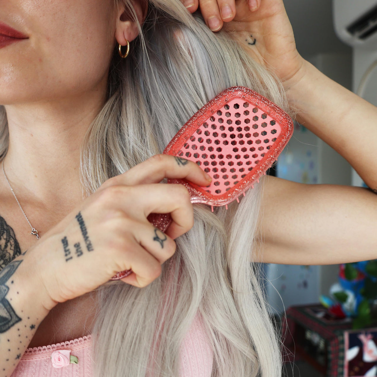 FHI Heat UNbrush Detangling Brush displayed on a vanity