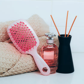 FHI Heat UNbrush Detangling Brush in a travel bag