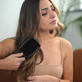 FHI Heat UNbrush Detangling Brush lifestyle scene on vanity