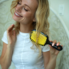 FHI Heat UNbrush Detangling Brush lifestyle scene with model