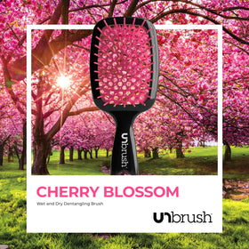 FHI Heat UNbrush Detangling Brush on a bathroom counter with hair products