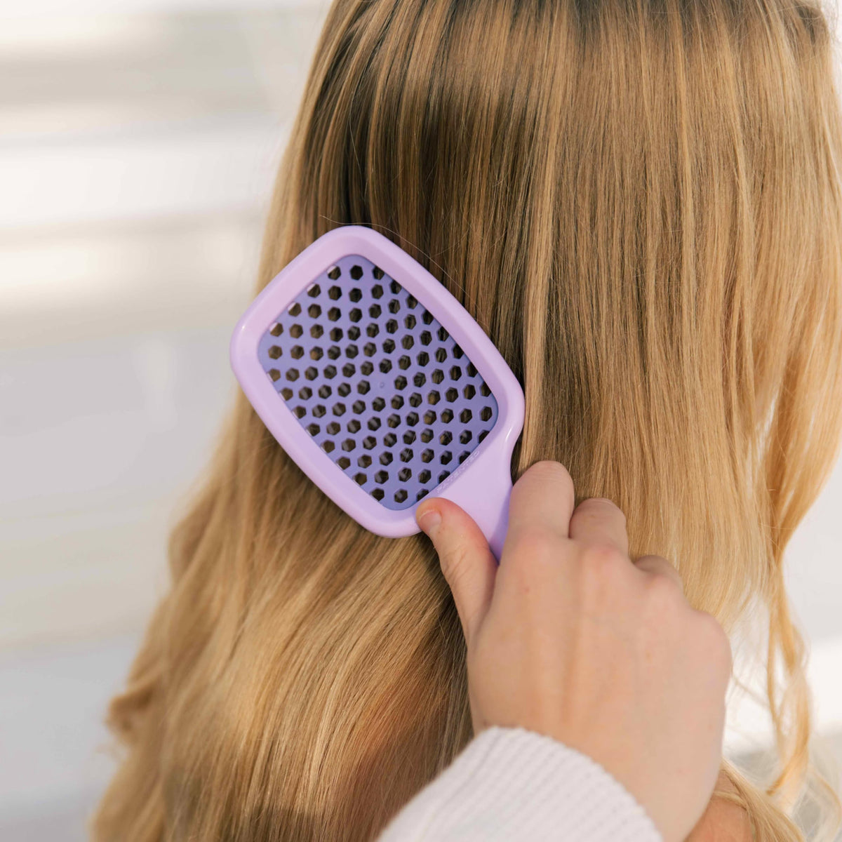 FHI Heat UNbrush Detangling Brush packaging display