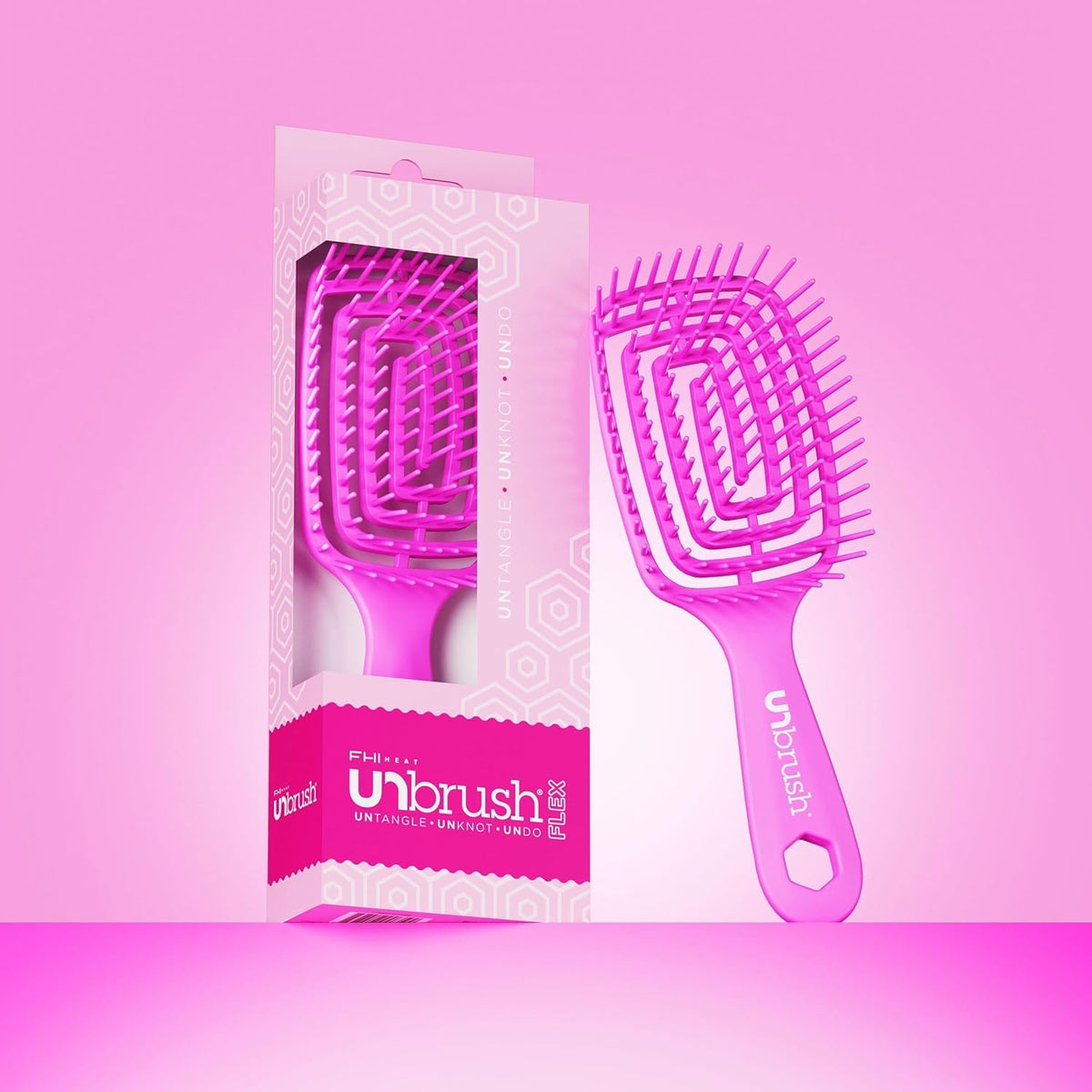 FHI Heat UNbrush Flex Detangling Brush held in hand for easy use