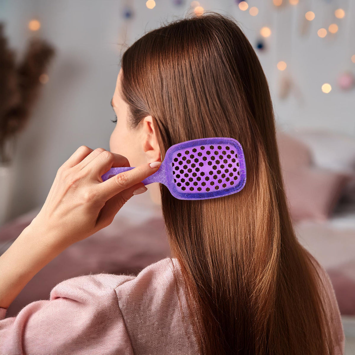 FHI Heat UNbrush Mini Detangling Brush in hand for easy handling