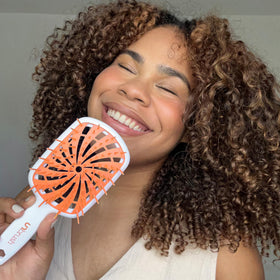FHI Heat UNbrush Plus Detangling Brush in hand
