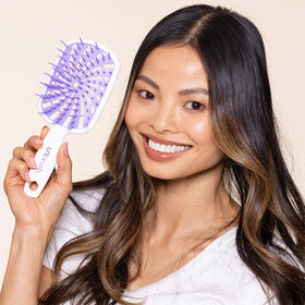 FHI Heat UNbrush Plus displayed on a bathroom counter
