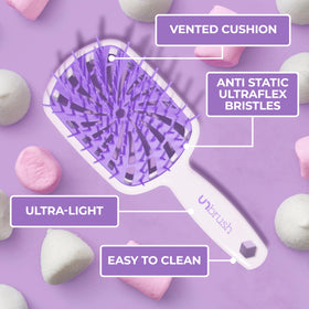 FHI Heat UNbrush Plus in use on dry straight hair