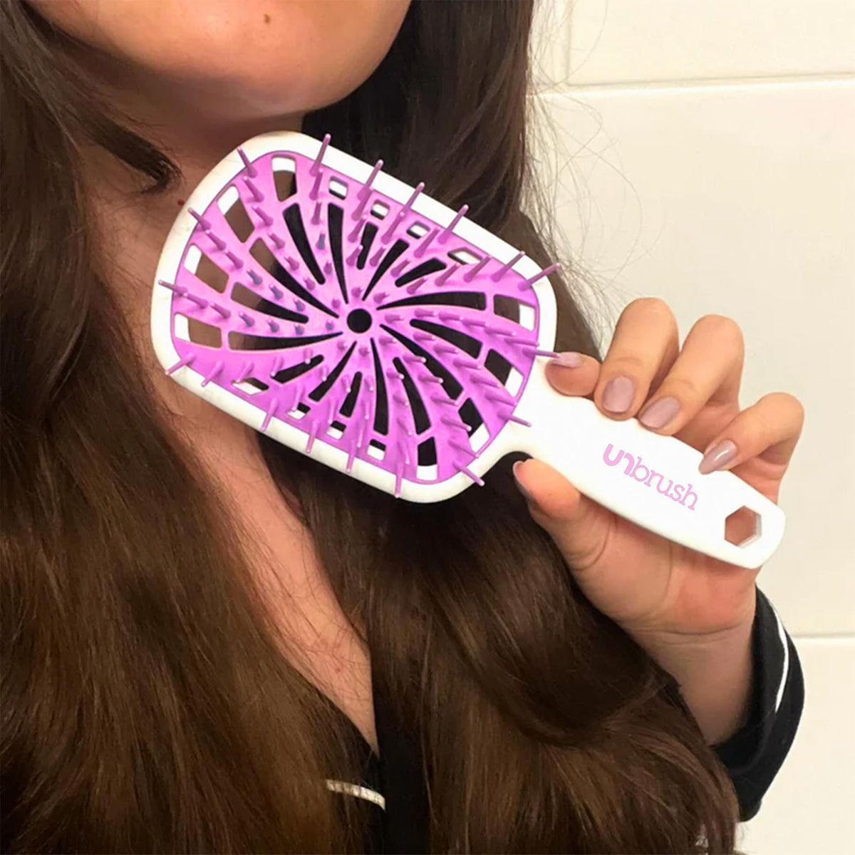 FHI Heat UNbrush Plus in use on wet hair
