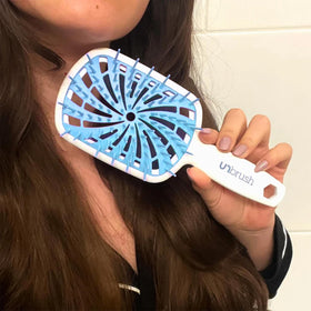 FHI Heat UNbrush Plus in use on wet hair