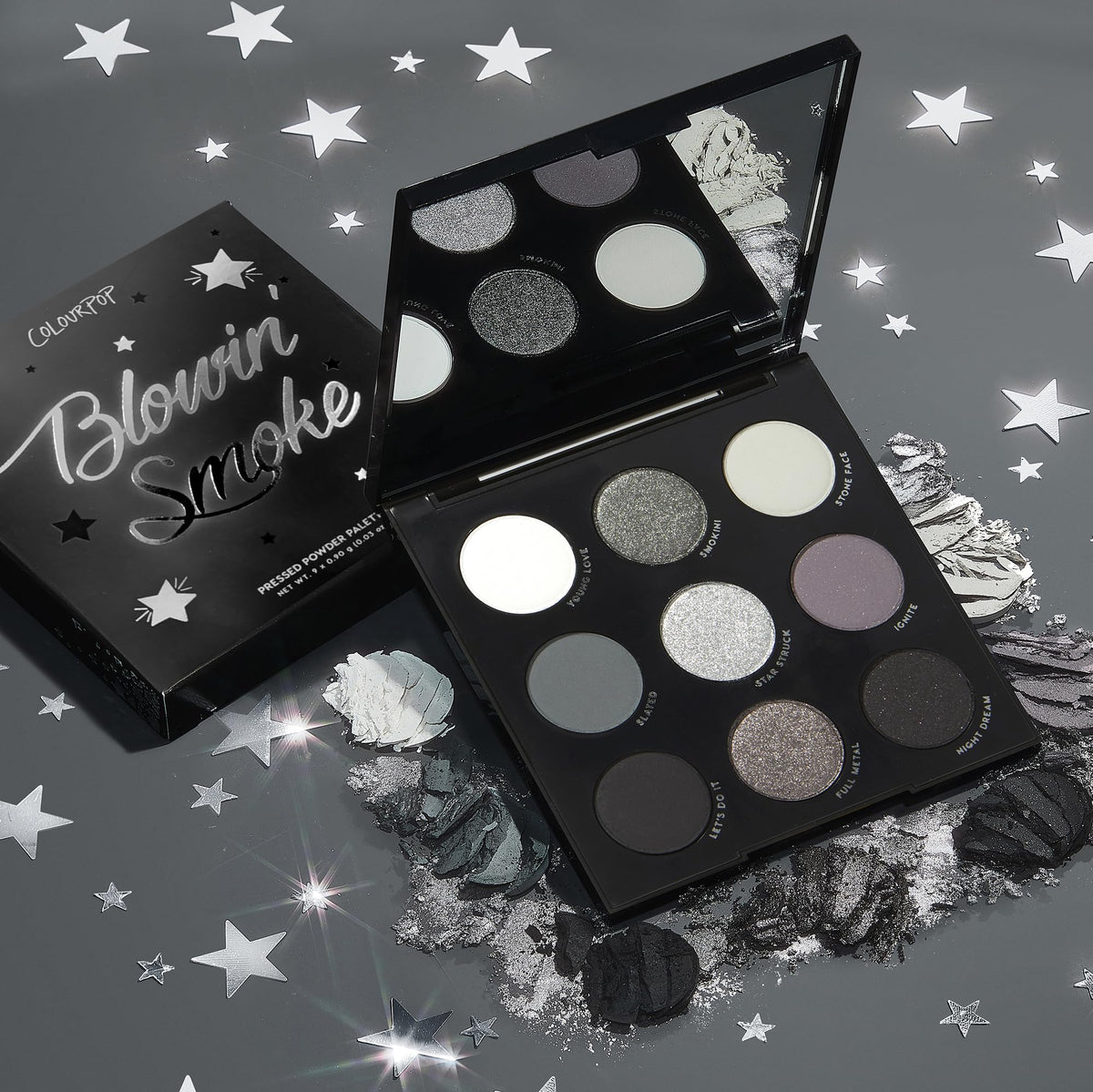 Flat lay of ColourPop Blowin' Smoke Eyeshadow Palette with brushes