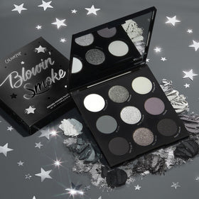 Flat lay of ColourPop Blowin' Smoke Eyeshadow Palette with brushes