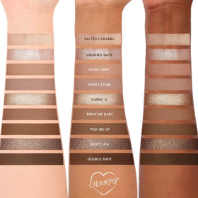 Flat lay of ColourPop Deja Brew Eyeshadow Palette with brushes