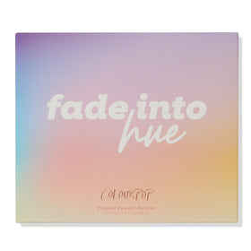 Flat lay of ColourPop Fade Into Hue Eyeshadow Palette with makeup accessories