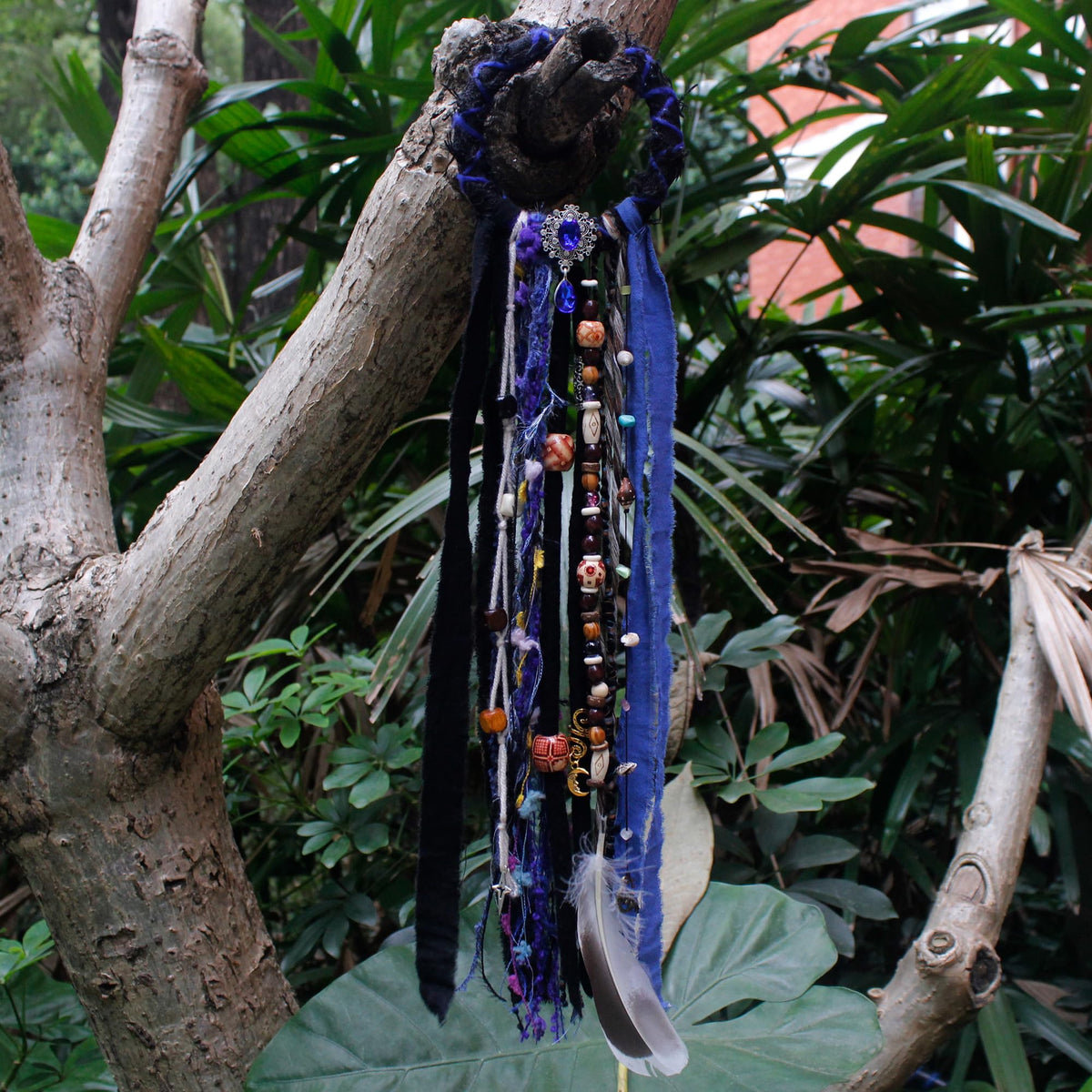Flat lay of multiple dreadlock hair ties in different styles