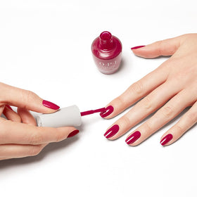 Flat lay of OPI Nature Strong nail polish with nature-inspired accessories
