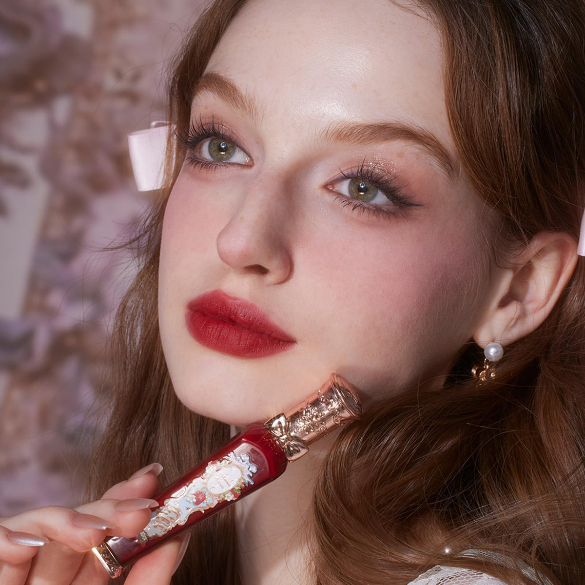 Flower Knows Lip Cream displayed with floral background