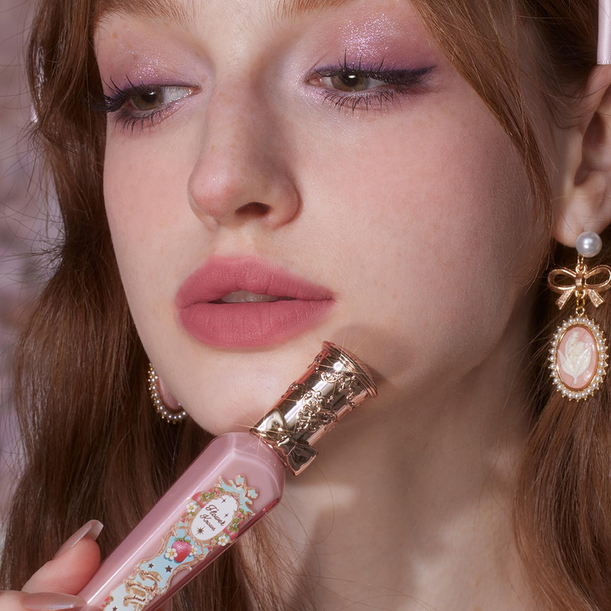 Flower Knows Strawberry Rococo Cloud Lip Cream on a vanity