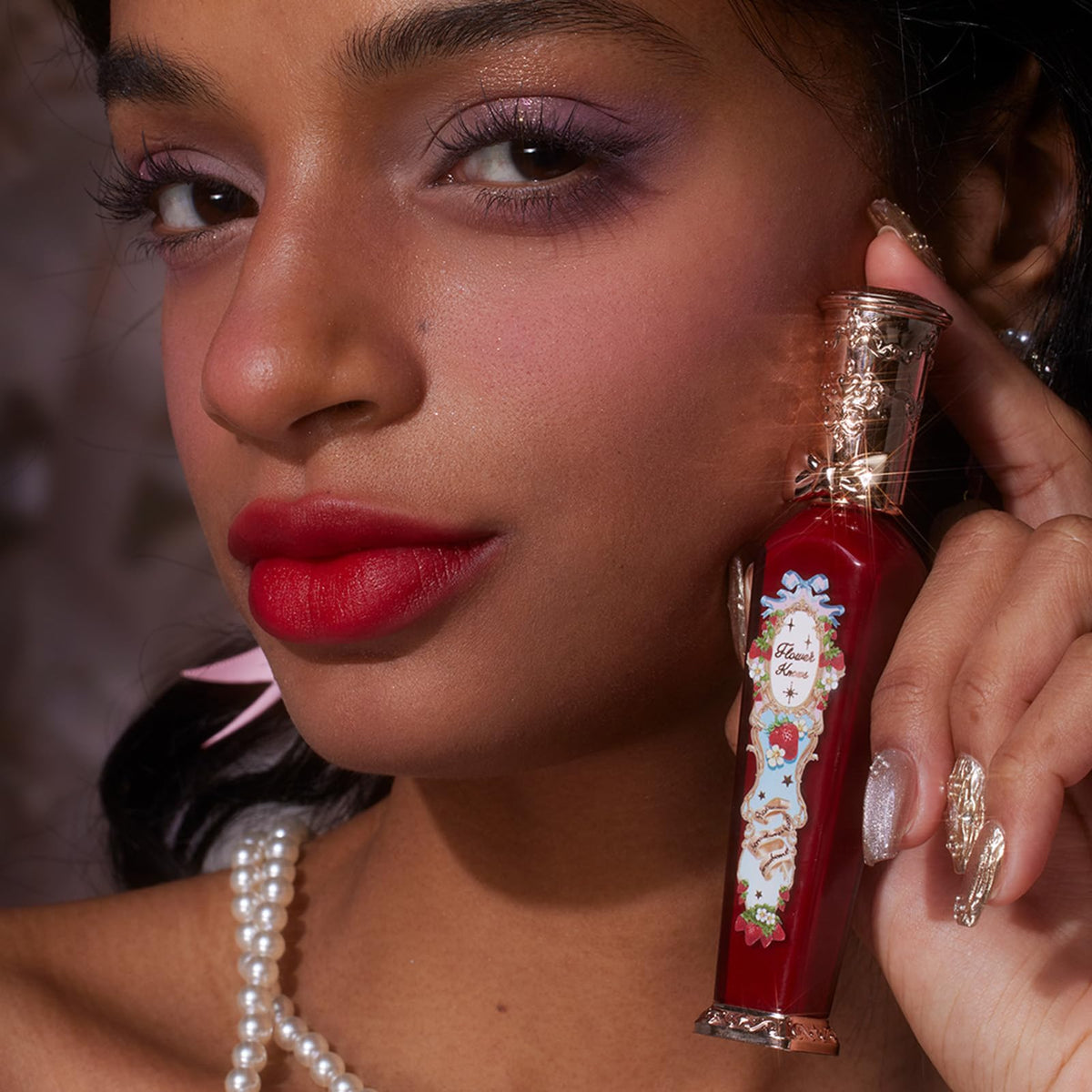 Flower Knows Strawberry Rococo Lip Cream in hand