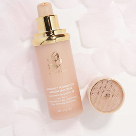 Forever Bloom Bio Mimic Foundation on vanity with flowers