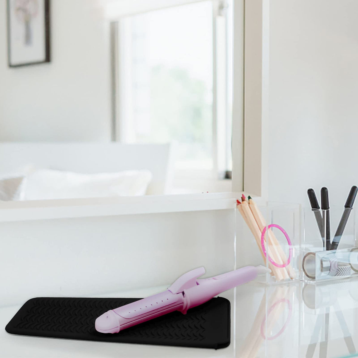 Fouews mat with hot hair tools placed on it