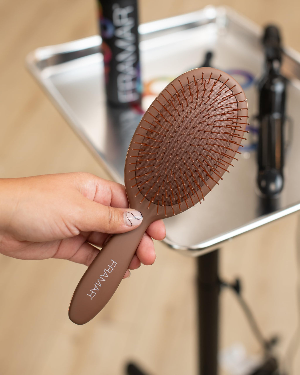 FRAMAR Chocolate Hair Brush Detangler on a vanity