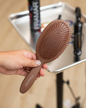FRAMAR Chocolate Hair Brush Detangler on a vanity