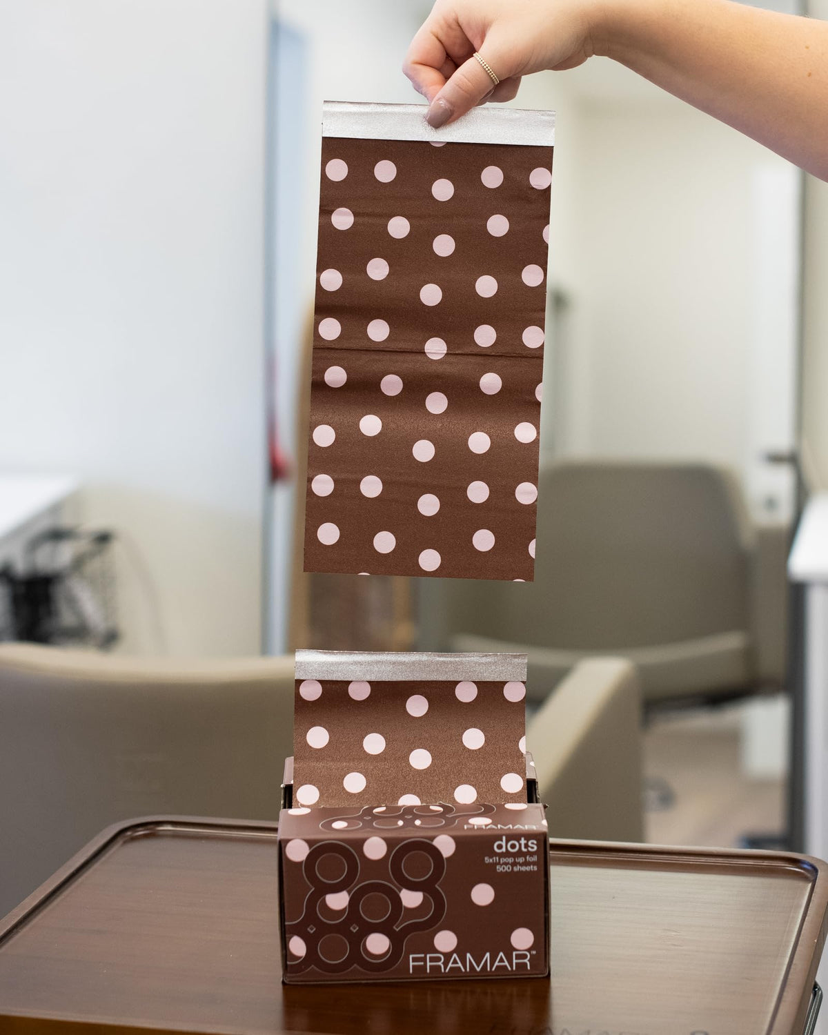 FRAMAR Chocolate Polka Dots Hair Foils in use during a hair highlighting session