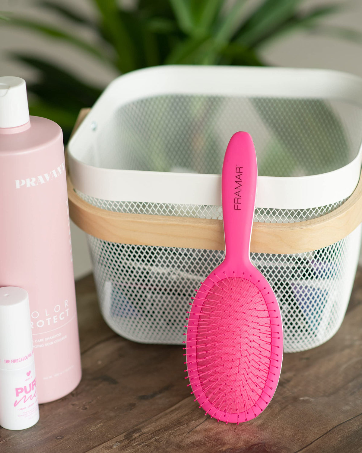 FRAMAR Detangling Brush displayed with other hair care tools