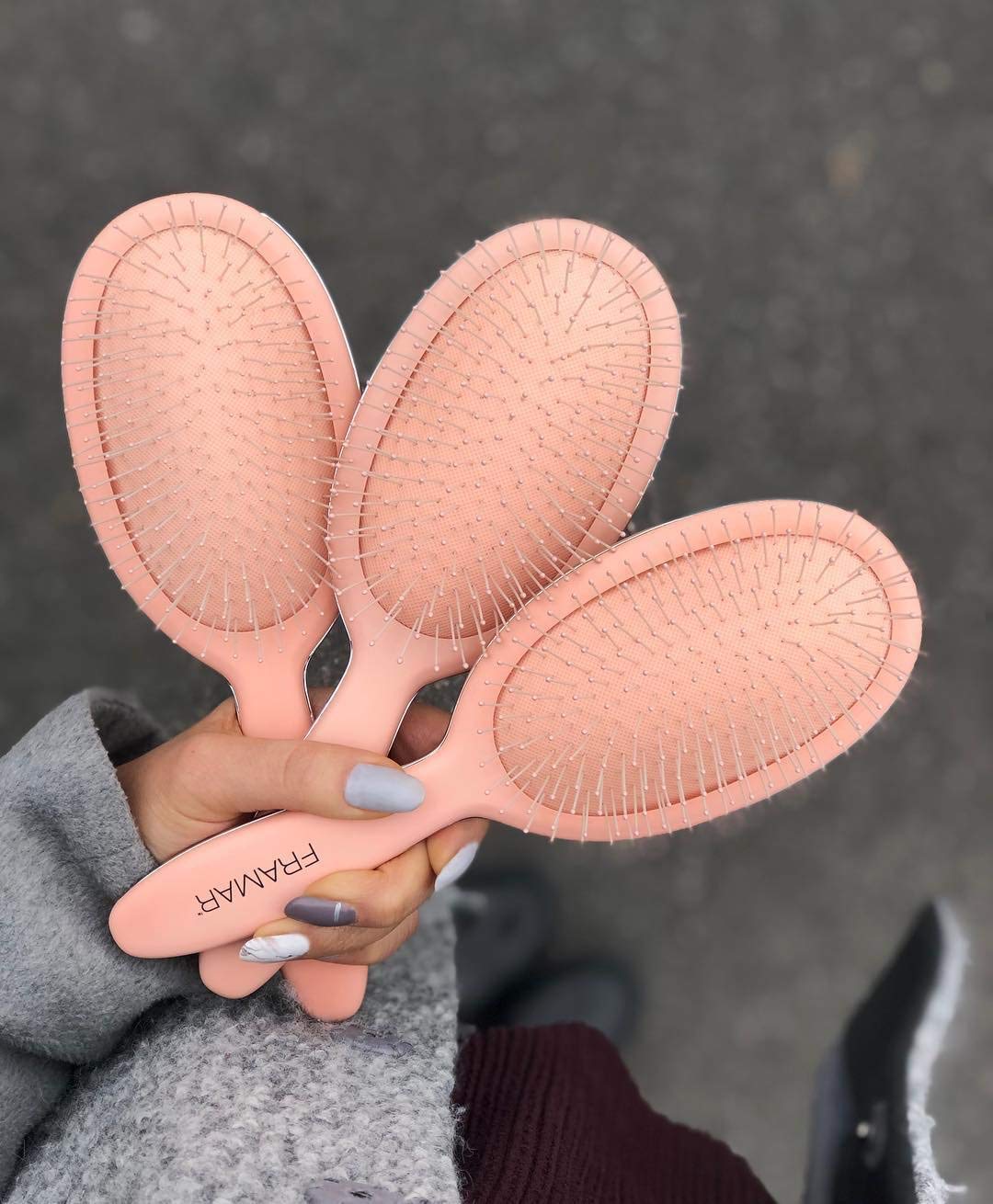 FRAMAR Detangling Brush in a stylish vanity setup