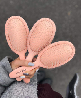 FRAMAR Detangling Brush in a stylish vanity setup