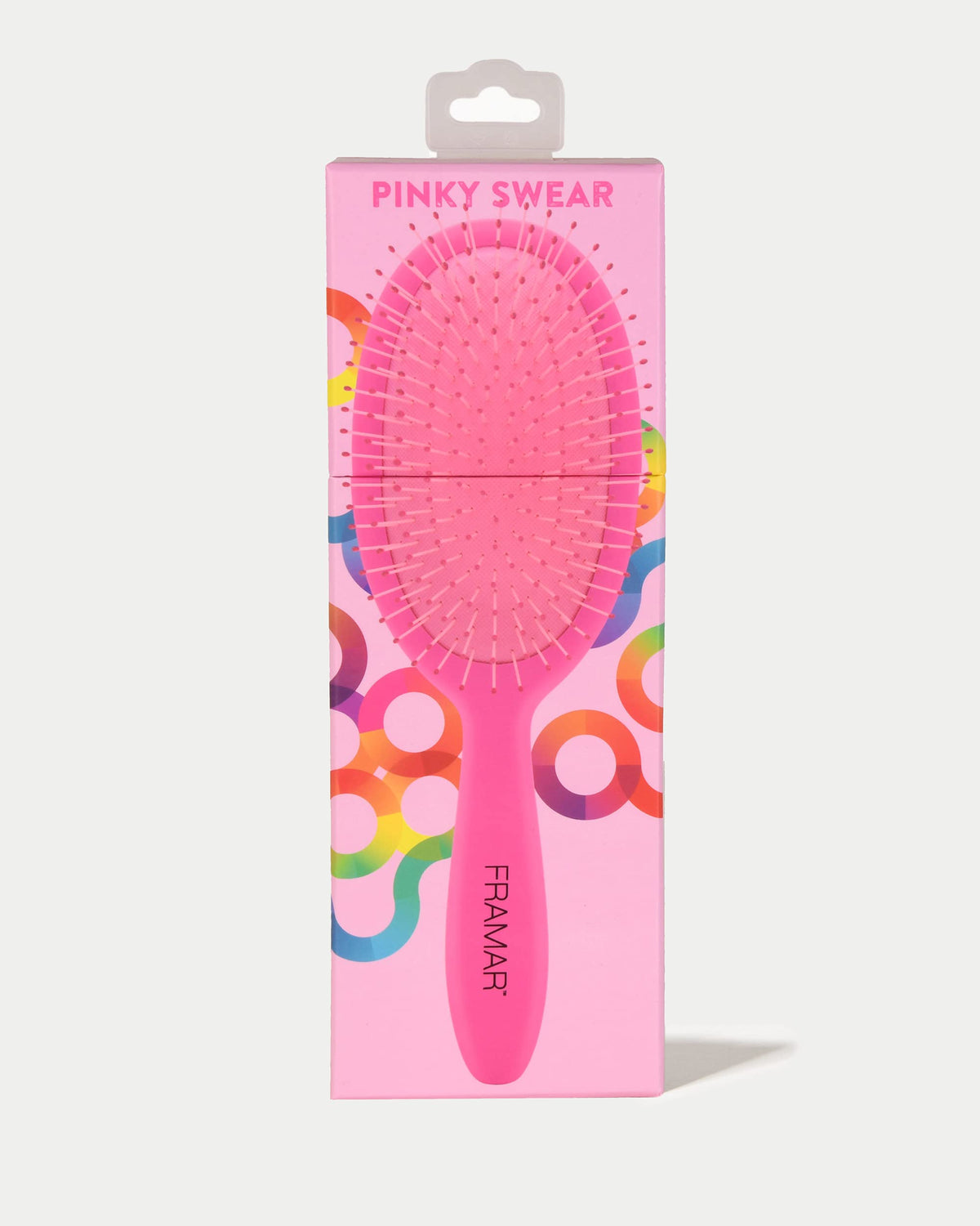 FRAMAR Detangling Brush in green on a vanity