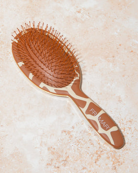 FRAMAR Wet Hair Brush Detangler in a stylish vanity setting