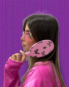 FRAMAR Y2K Print Hair Brush Detangler being used on wet hair