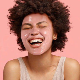 Freeman French Pink Clay Peel-Off Face Mask being peeled off