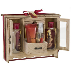 Freida and Joe Bath and Body Gift Basket in natural wood cabinet