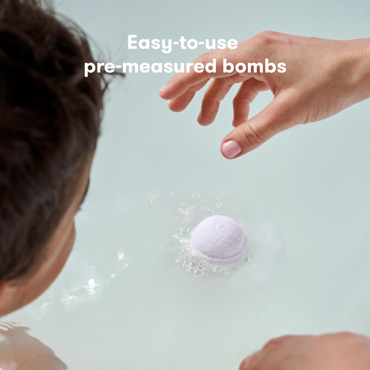 Frida Natural Sleep Bath Bombs in a child's bath setting