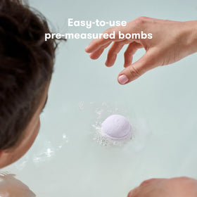 Frida Natural Sleep Bath Bombs in a child's bath setting