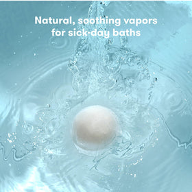 Frida Natural Vapor Bath Bombs in a bath setting